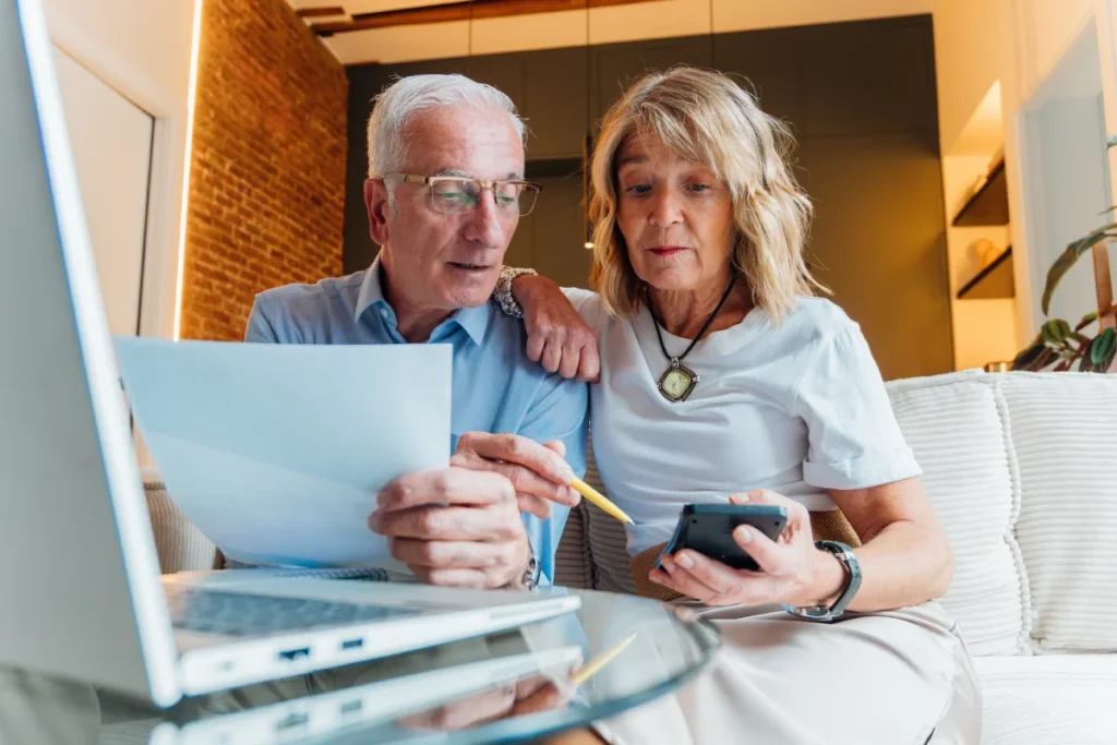 Senior couple looking at finance options