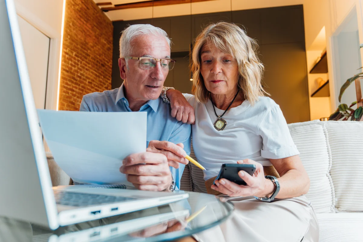 Senior couple looking at finance options